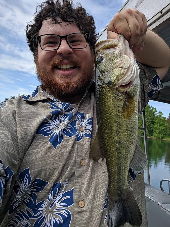 Kyle smiling with fish