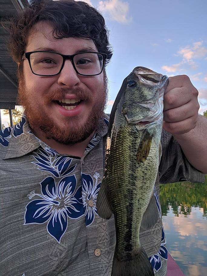 Kyle with bass smiling